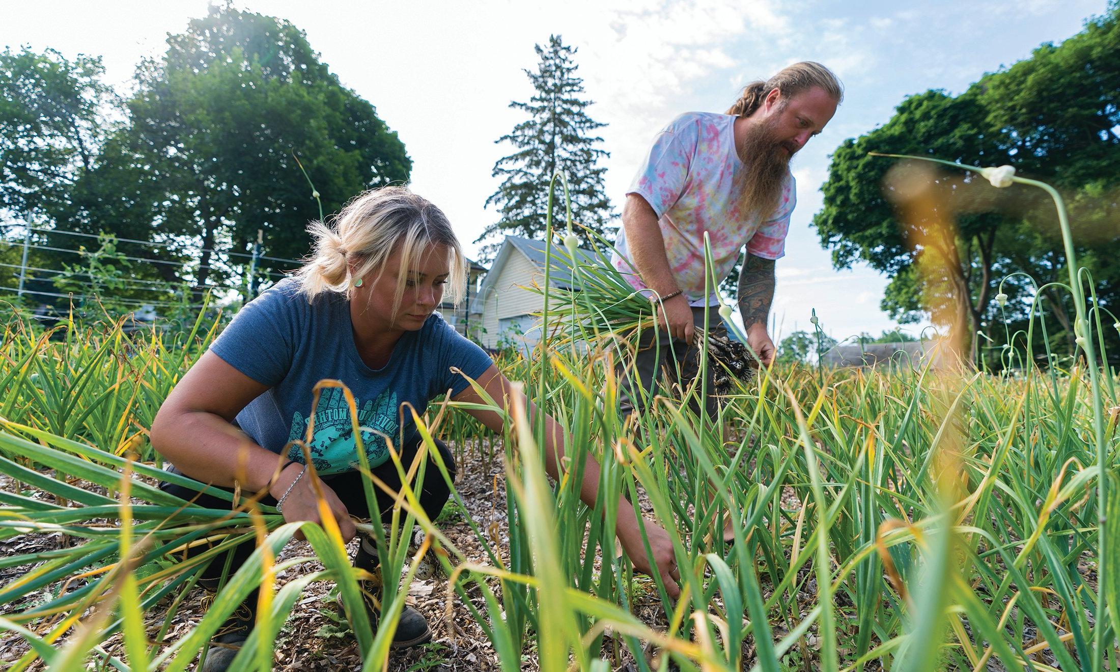 A man and women in a garden.